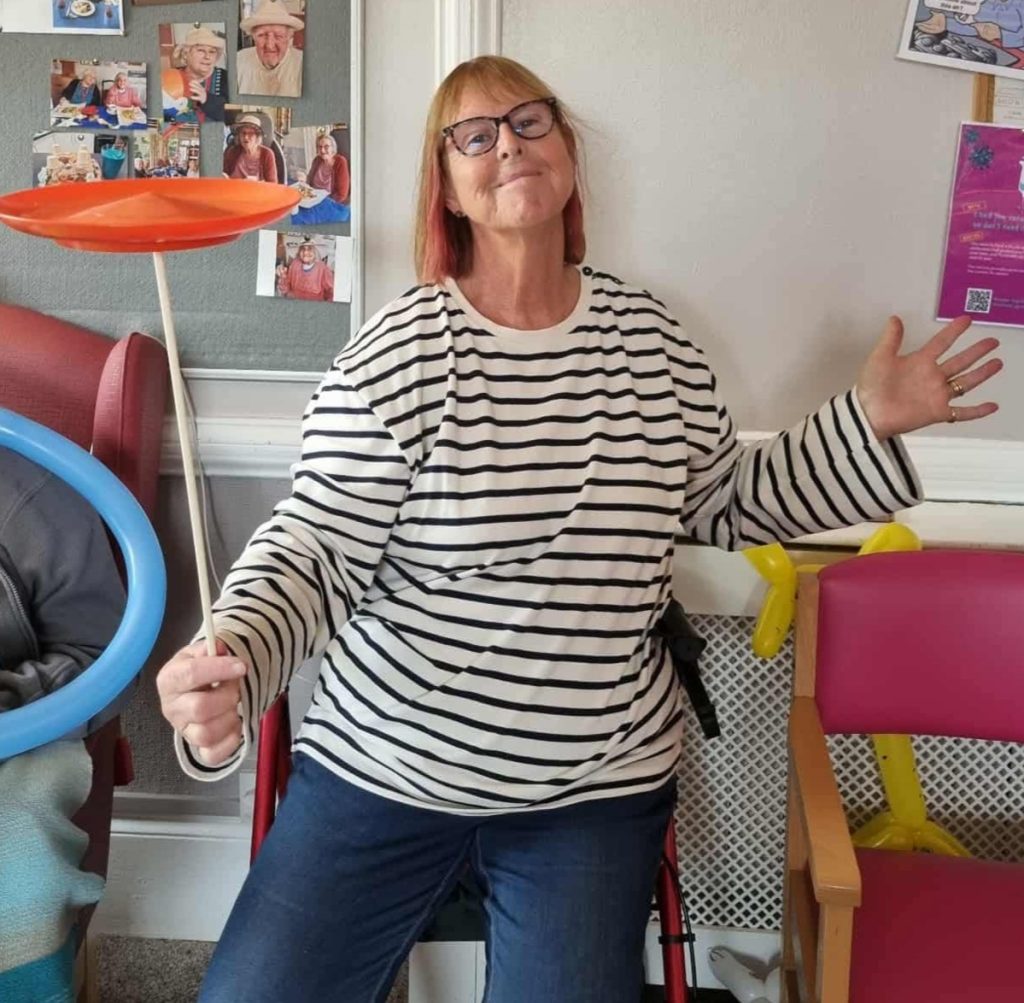 Woman juggling a plate happily