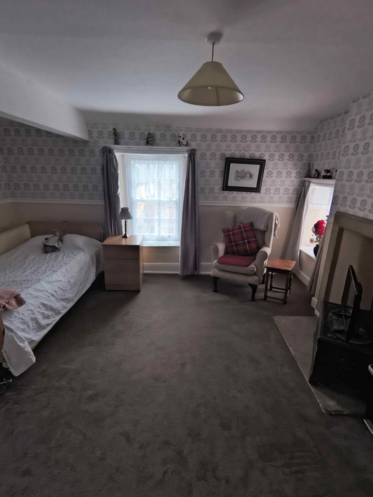 Cozy bedroom with armchair