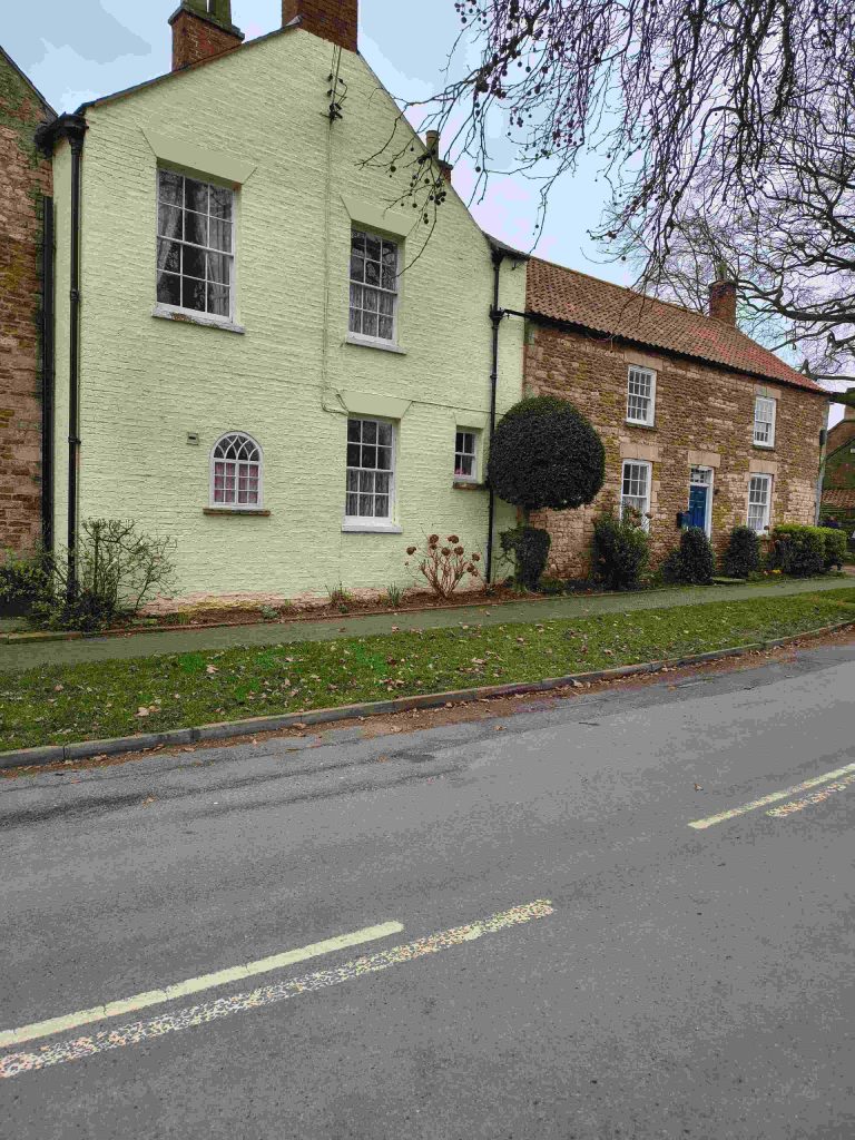 Two houses beside a road